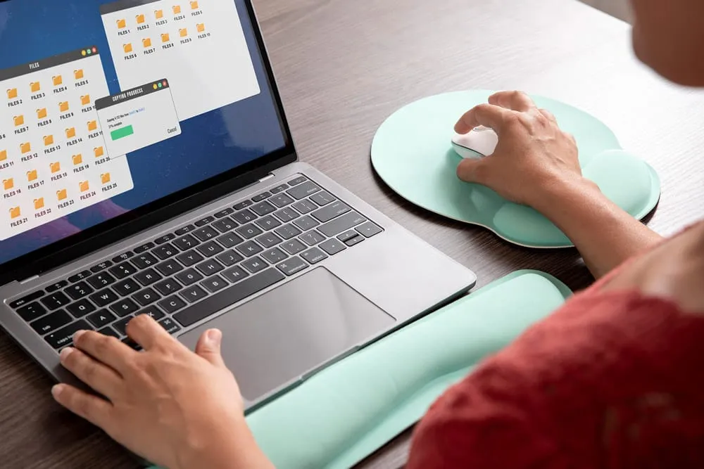 a woman work at mouse pad with wrist